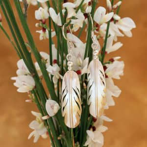 sterling silver feather earrings by Harvey Chavez