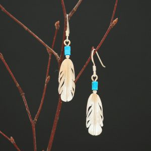 silver feather earrings by Harvey Chavez