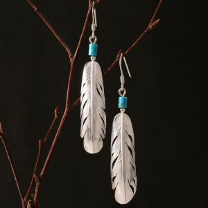feather earrings by Harvey Chavez