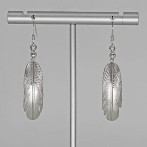 silver feather earrings by Harvey Chavez
