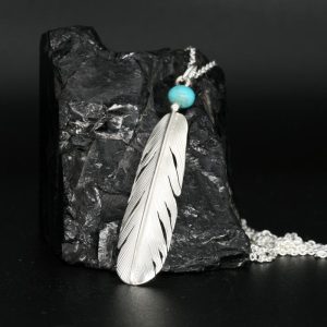 silver feather pendant by Harvey Chavez