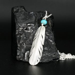 Silver feather pendant by Harvey Chavez