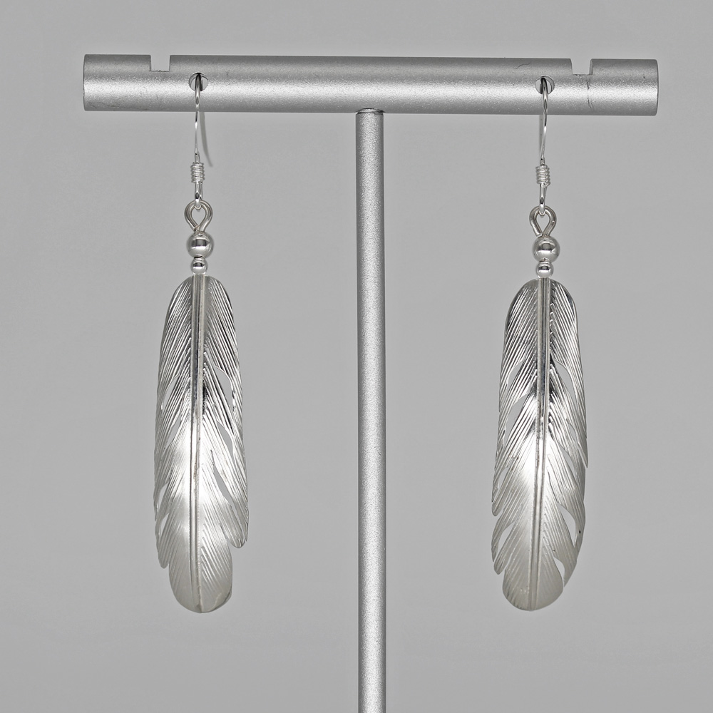 Sterling silver feather earrings by Harvey Chavez