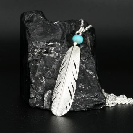 Silver feather pendant by Harvey Chavez